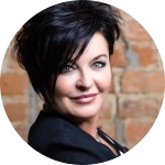 Karen Goslin, therapist and author of Yellow Paint Learning to Live Again, smiling at office